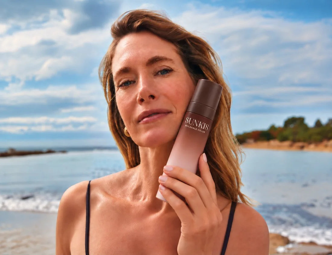 Woman holding the SUNKIS bottle against her cheek