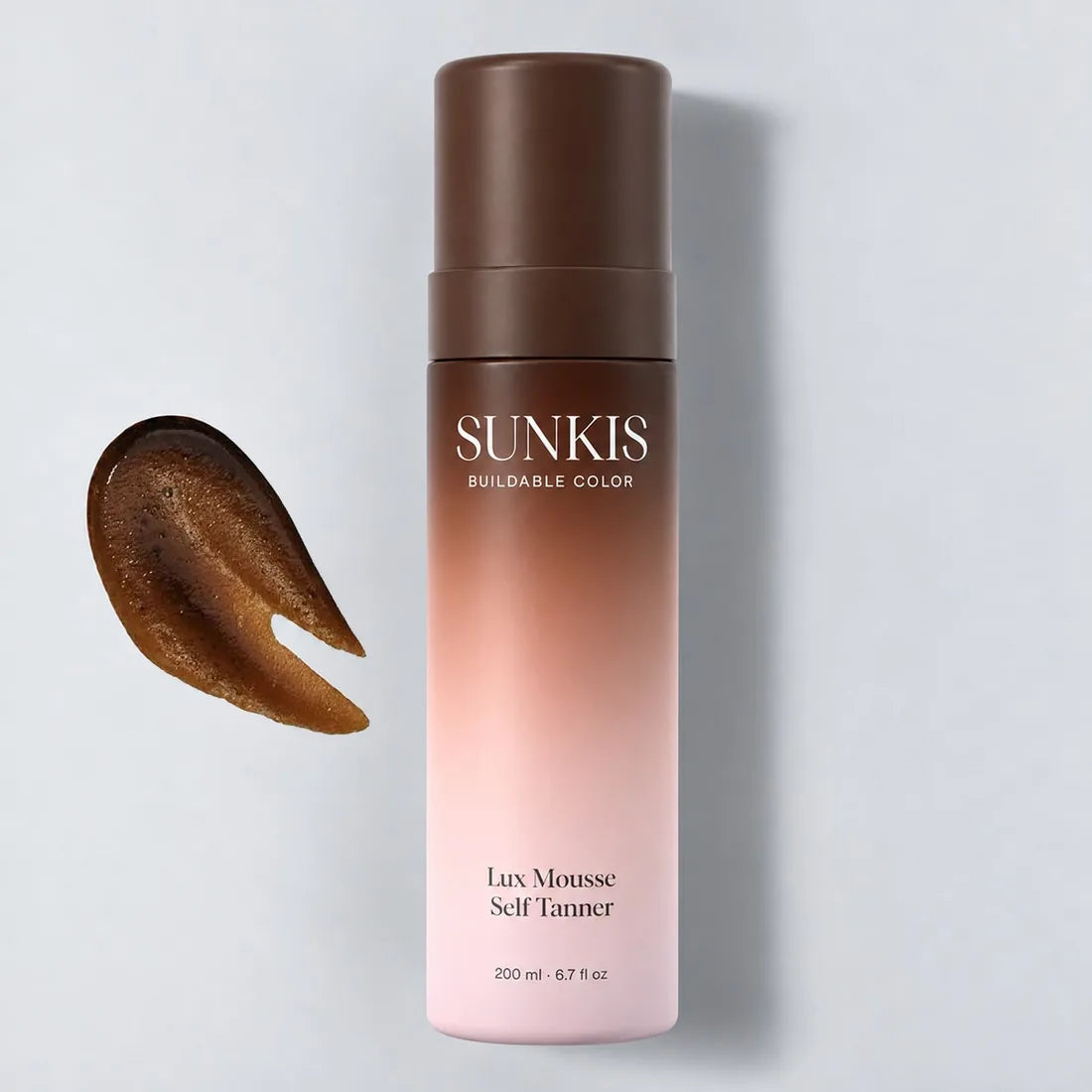 SUNKIS Lux Mousse Self Tanner bottle with a swatch of the mousse