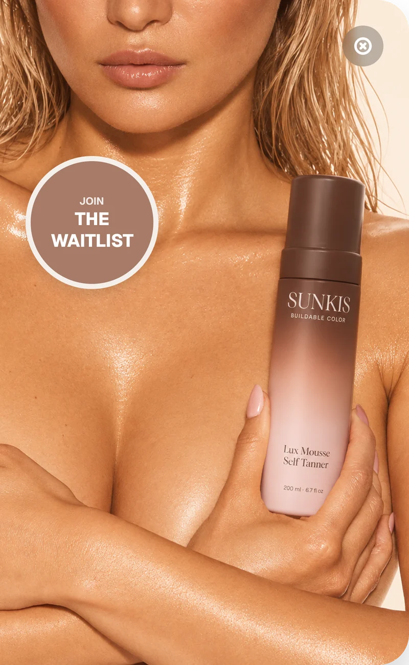 Join the waitlist: model holding the SUNKIS Lux Mousse Self Tanner bottle